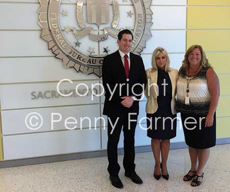 With FBI Special Agent David Sesma and Victim Specialist Carol Watson (right).