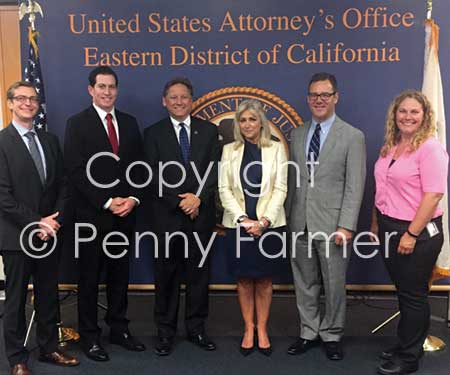 Pictured with penny (centre) from left to right: (AUSA) Jeremy J. Kelley; (FBI SA) David J. Sesma; (US Attorney) Philip A. Talbert; (AUSA) Matt Segal and Detective Amy Crosby. 